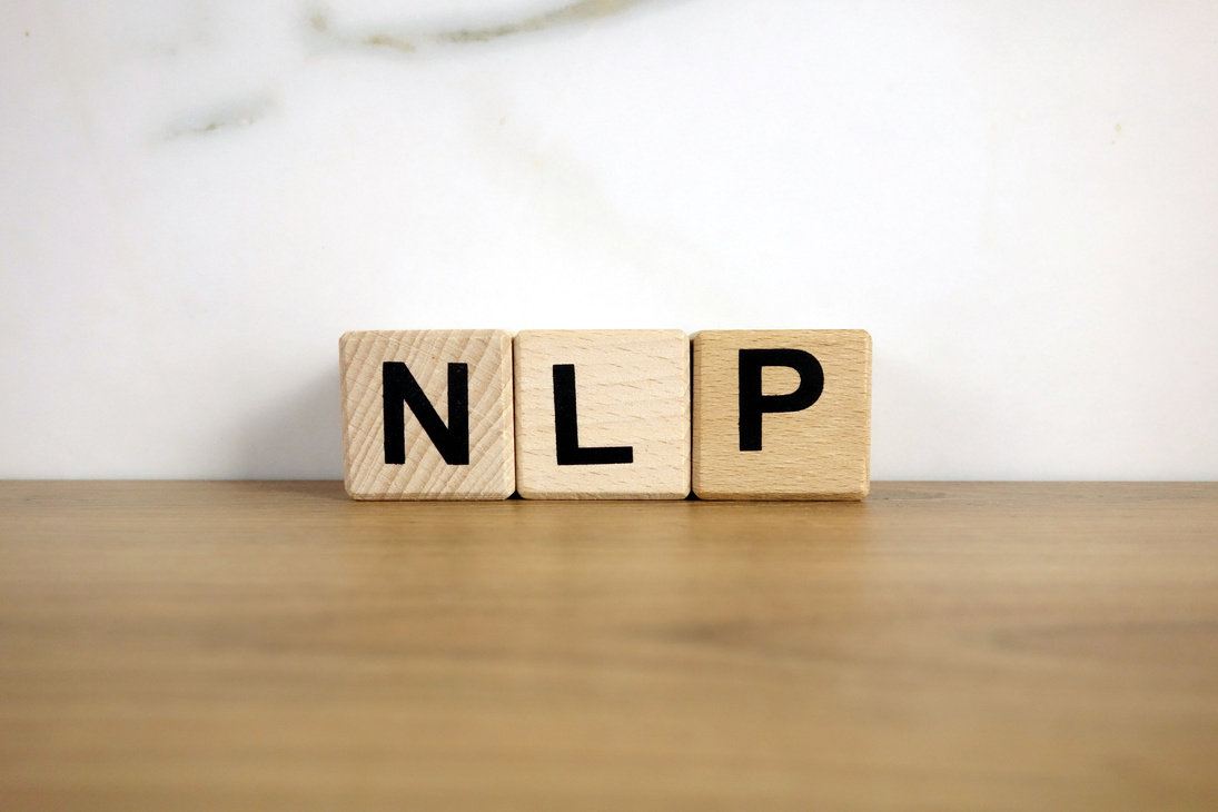 NLP neuro linguistic programming abbreviation from wooden blocks